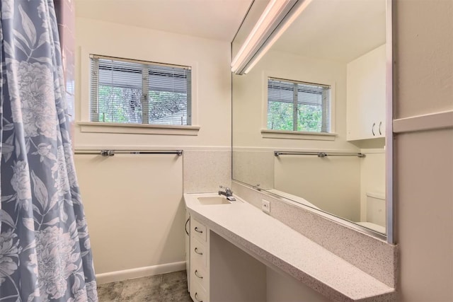 bathroom featuring vanity and a shower with curtain