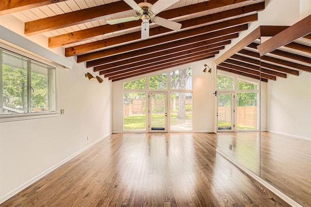 unfurnished living room featuring baseboards, ceiling fan, and wood finished floors