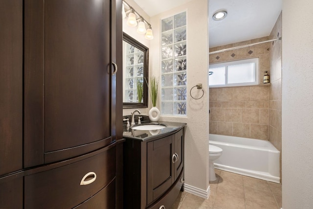 8011 Tantara Ct, Austin, TX 78729 - full bath featuring tile patterned flooring, toilet, vanity, and  shower combination