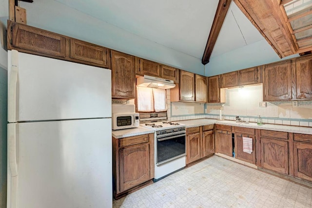 kitchen featuring brown cabinetry, white appliances, light floors, light countertops, and under cabinet range hood