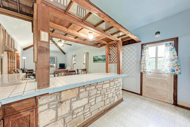 interior space featuring an outdoor bar and ceiling fan