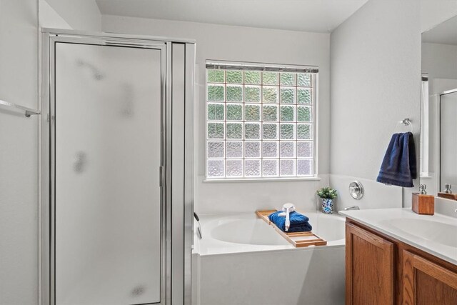 12804 Council Bluff Dr, Austin, TX 78727 - bathroom with a shower stall, vanity, and a garden tub