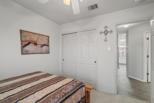 bedroom featuring baseboards, a ceiling fan, a closet, and visible vents