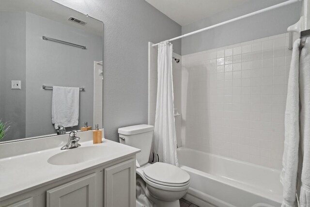 12804 Council Bluff Dr, Austin, TX 78727 - full bathroom featuring toilet, shower / bath combo with shower curtain, and vanity