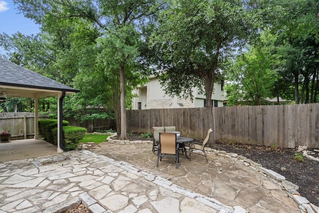 view of patio featuring a fenced backyard and outdoor dining space