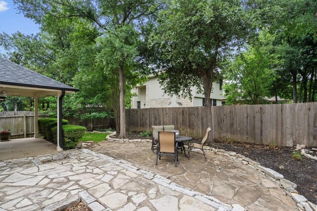 12804 Council Bluff Dr, Austin, TX 78727 - fenced backyard featuring a patio and outdoor dining area