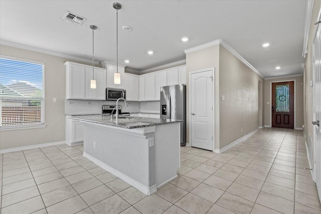 kitchen with visible vents, ornamental molding, appliances with stainless steel finishes, and light tile patterned floors