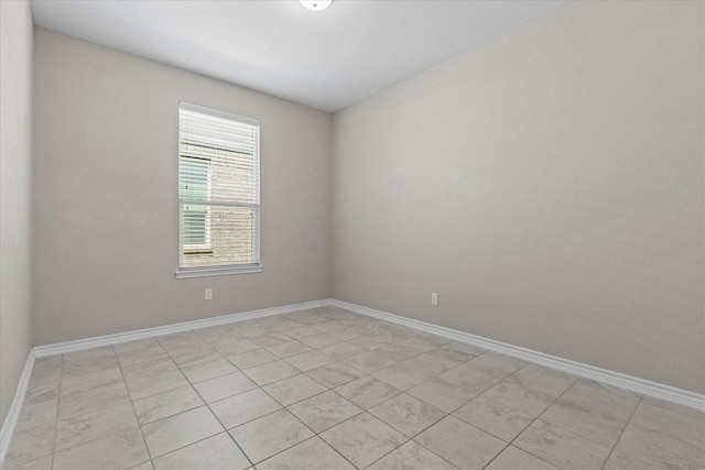 empty room with baseboards