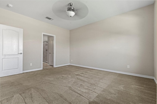 unfurnished room with visible vents, a ceiling fan, baseboards, and carpet flooring
