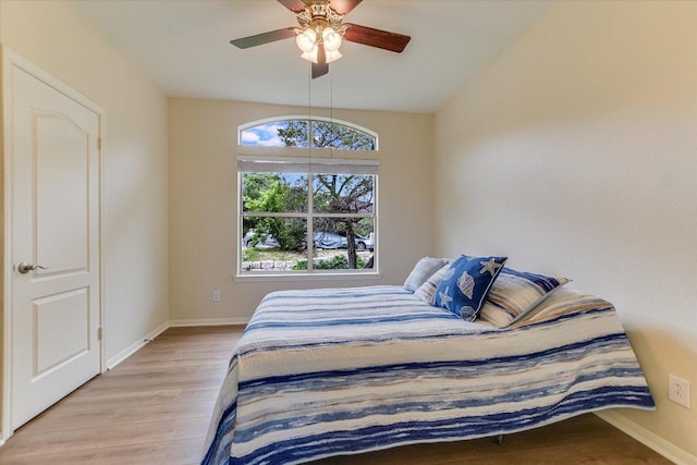 6000 Shepherd Mountain Cv Unit 2007, Austin, TX 78730 - bedroom with light wood-style floors, baseboards, and ceiling fan