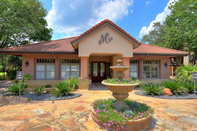 6000 Shepherd Mountain Cv Unit 2007, Austin, TX 78730 - view of front of home with french doors, a tiled roof, and stucco siding