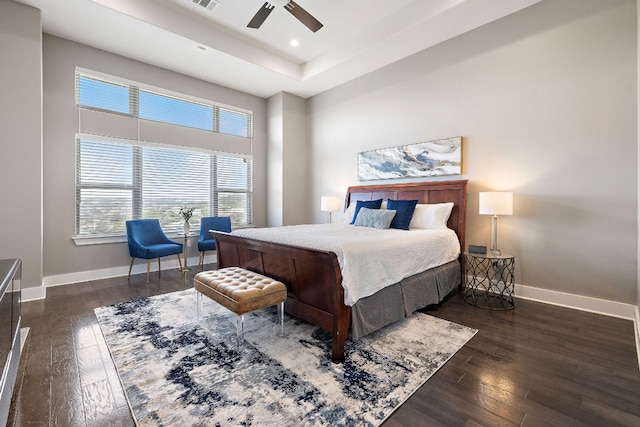 1304 High Lonesome, Leander, TX 78641 - bedroom featuring baseboards, wood finished floors, a tray ceiling, and recessed lighting