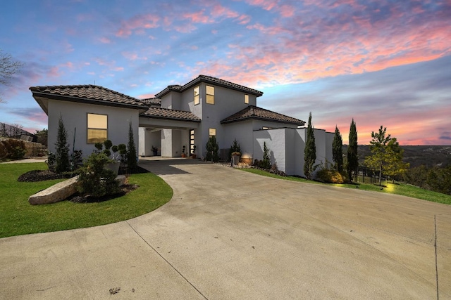 1304 High Lonesome, Leander, TX 78641 - mediterranean / spanish house with a tiled roof, concrete driveway, and stucco siding
