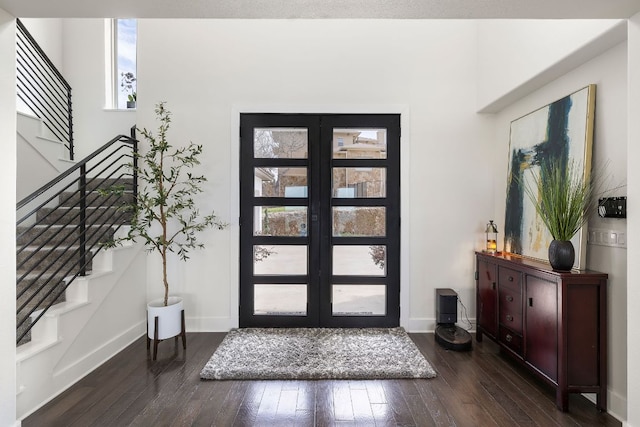 1304 High Lonesome, Leander, TX 78641 - foyer entrance with dark wood finished floors, stairs, and baseboards
