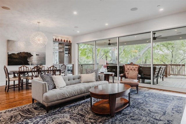 4801 Balcones Dr, Austin, TX 78731 - living room featuring wood finished floors, a ceiling fan, recessed lighting, and a chandelier