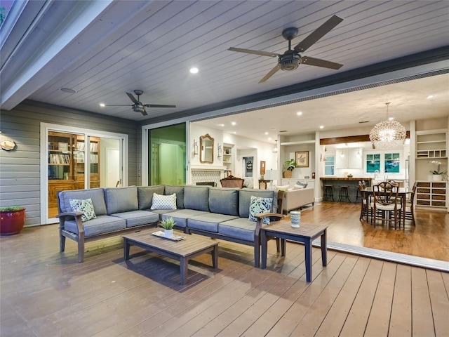 4801 Balcones Dr, Austin, TX 78731 - living area with a ceiling fan, wood-type flooring, a chandelier, a brick fireplace, and recessed lighting