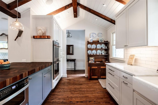 4801 Balcones Dr, Austin, TX 78731 - kitchen featuring open shelves, dark wood-style floors, wood counters, tasteful backsplash, and stainless steel double oven