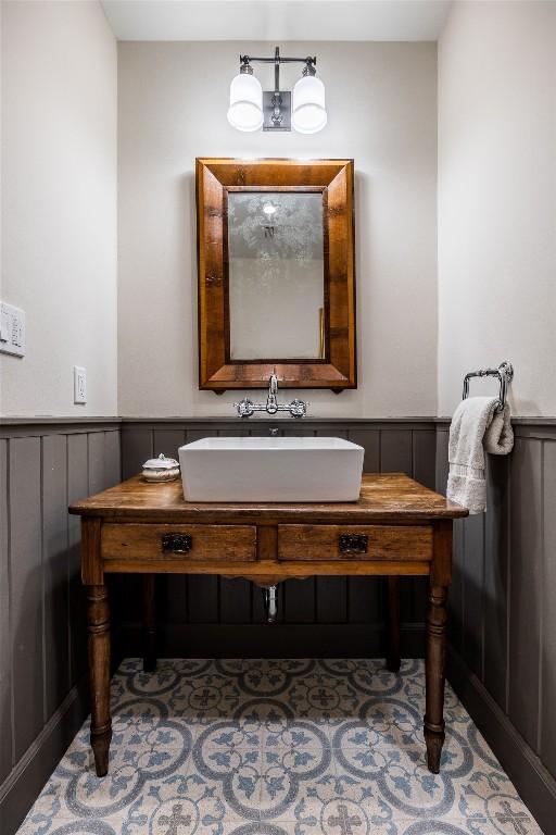 4801 Balcones Dr, Austin, TX 78731 - bathroom with wainscoting and vanity
