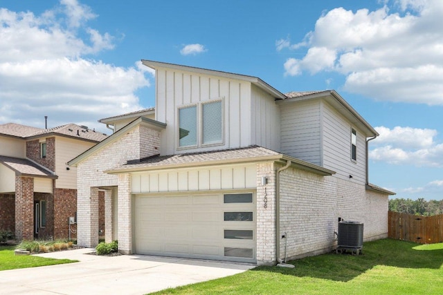 1208 Tipton St, Georgetown, TX 78633 - view of front facade featuring board and batten siding, driveway, an attached garage, and cooling unit