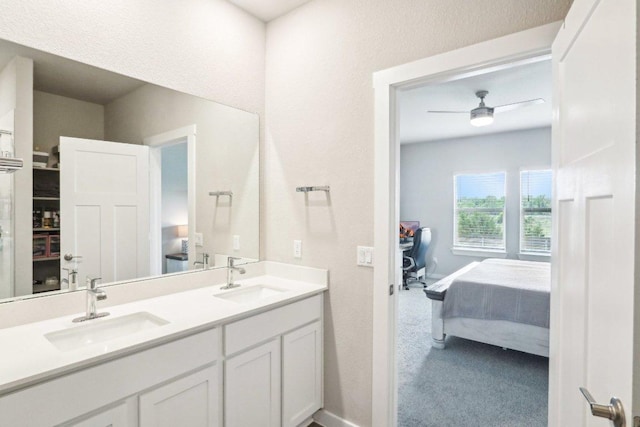 1208 Tipton St, Georgetown, TX 78633 - ensuite bathroom featuring double vanity, ceiling fan, and baseboards