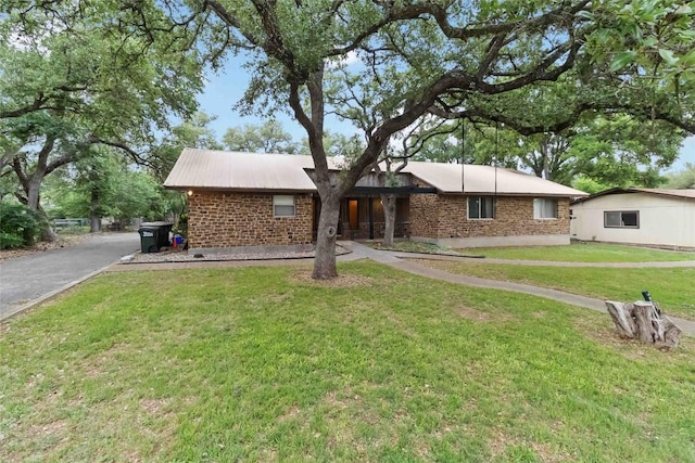 1402 Brown St, San Marcos, TX 78666 - single story home featuring a front lawn and brick siding