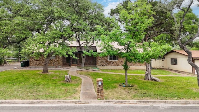 1402 Brown St, San Marcos, TX 78666 - obstructed view of property with a front lawn