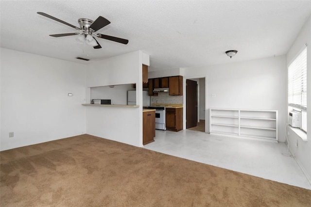1402 Brown St, San Marcos, TX 78666 - kitchen with decorative backsplash, refrigerator, open floor plan, ceiling fan, and range
