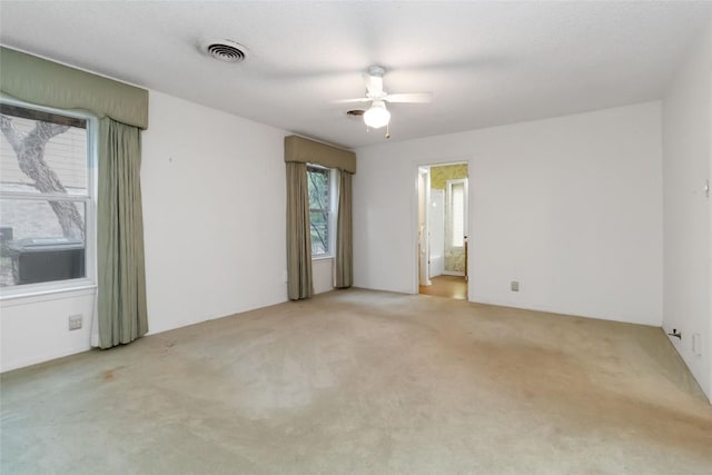 1402 Brown St, San Marcos, TX 78666 - carpeted spare room with a ceiling fan and visible vents