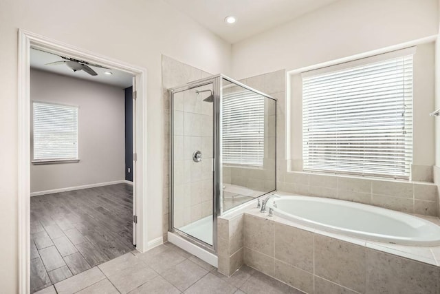 bathroom featuring baseboards, recessed lighting, tile patterned floors, a bath, and a shower stall