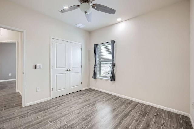 7808 Glover Dr, Austin, TX 78744 - unfurnished bedroom featuring light wood-style flooring, a closet, ceiling fan, and recessed lighting