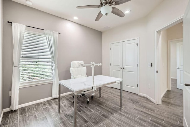office space featuring baseboards, a ceiling fan, recessed lighting, and wood finished floors