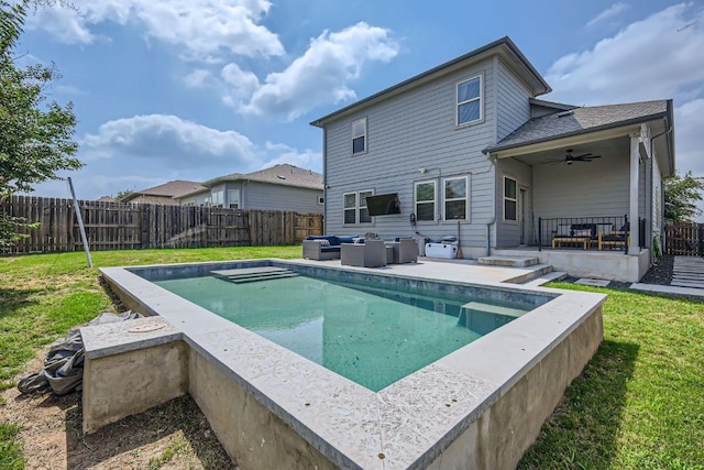 view of swimming pool with a yard, ceiling fan, an outdoor hangout area, and a fenced backyard