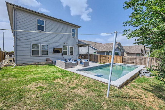 back of property featuring a yard, outdoor lounge area, and a fenced backyard