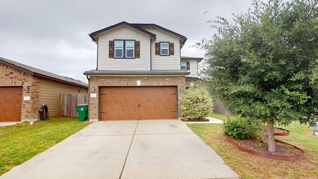 387 Gustaf Trl, Kyle, TX 78640 - view of front facade with brick siding, a garage, concrete driveway, and a front yard