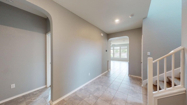 387 Gustaf Trl, Kyle, TX 78640 - hallway featuring arched walkways and stairway