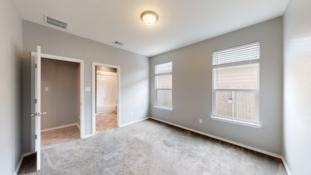 387 Gustaf Trl, Kyle, TX 78640 - unfurnished bedroom with carpet flooring and ensuite bathroom