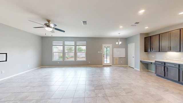 387 Gustaf Trl, Kyle, TX 78640 - kitchen with open floor plan, light countertops, recessed lighting, dark brown cabinetry, and ceiling fan