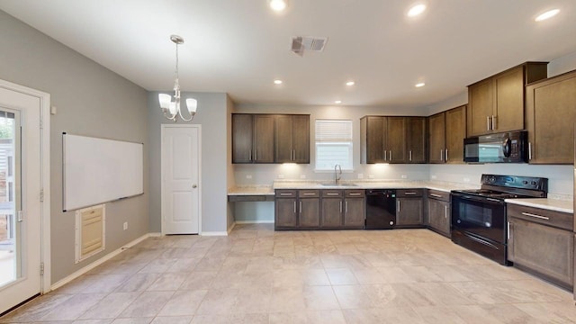 387 Gustaf Trl, Kyle, TX 78640 - kitchen with black appliances, plenty of natural light, light countertops, dark brown cabinets, and recessed lighting