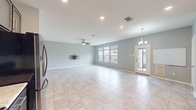 387 Gustaf Trl, Kyle, TX 78640 - kitchen featuring freestanding refrigerator, ceiling fan, recessed lighting, light tile patterned flooring, and a chandelier