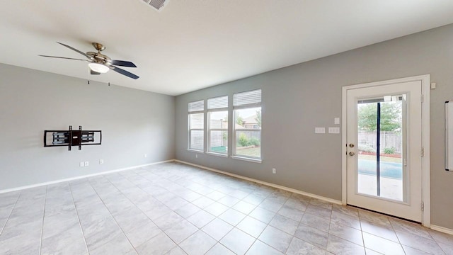 387 Gustaf Trl, Kyle, TX 78640 - unfurnished room featuring light tile patterned flooring and ceiling fan