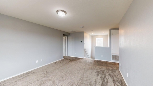 387 Gustaf Trl, Kyle, TX 78640 - spare room featuring carpet flooring and baseboards