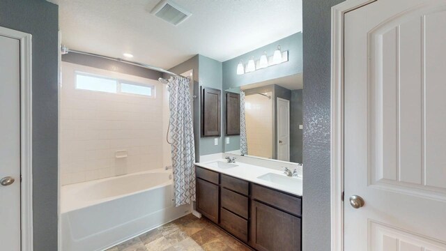 387 Gustaf Trl, Kyle, TX 78640 - full bathroom with double vanity and shower / bath combination with curtain
