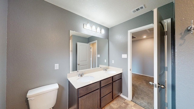 387 Gustaf Trl, Kyle, TX 78640 - bathroom with a textured wall and double vanity