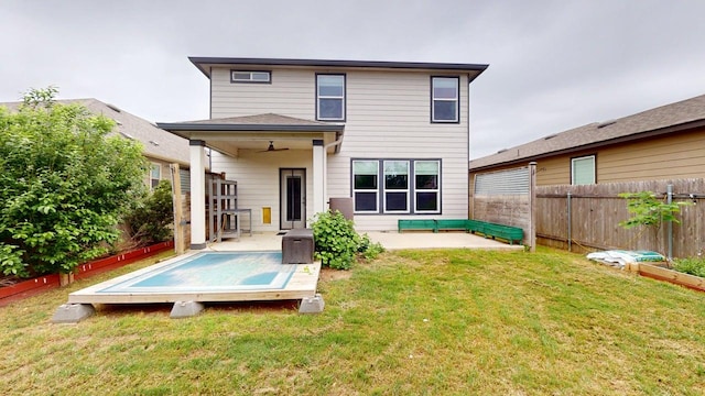 387 Gustaf Trl, Kyle, TX 78640 - back of house featuring a fenced backyard, a ceiling fan, a deck, and a patio area