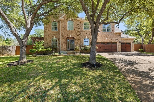 3109 Brigham Ct, Austin, TX 78732 - view of front facade with brick siding, driveway, and a garage