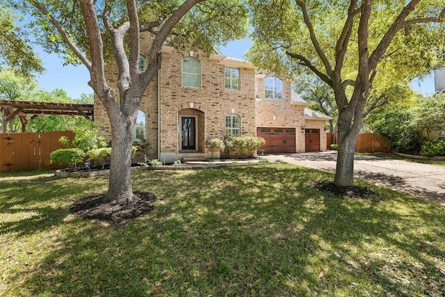 3109 Brigham Ct, Austin, TX 78732 - view of front of house featuring fence, concrete driveway, a front yard, and brick siding