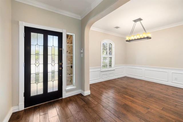 3109 Brigham Ct, Austin, TX 78732 - foyer entrance featuring visible vents, ornamental molding, wainscoting, and dark wood-style floors