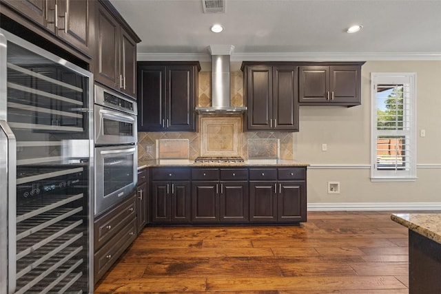 3109 Brigham Ct, Austin, TX 78732 - kitchen with visible vents, dark wood-style floors, ornamental molding, stainless steel appliances, and wall chimney exhaust hood