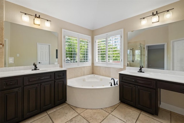 3109 Brigham Ct, Austin, TX 78732 - full bathroom featuring a whirlpool tub, two vanities, a sink, and a stall shower