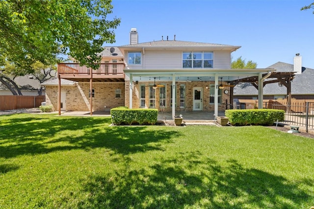 3109 Brigham Ct, Austin, TX 78732 - rear view of house with fence, brick siding, a deck, a patio, and a yard